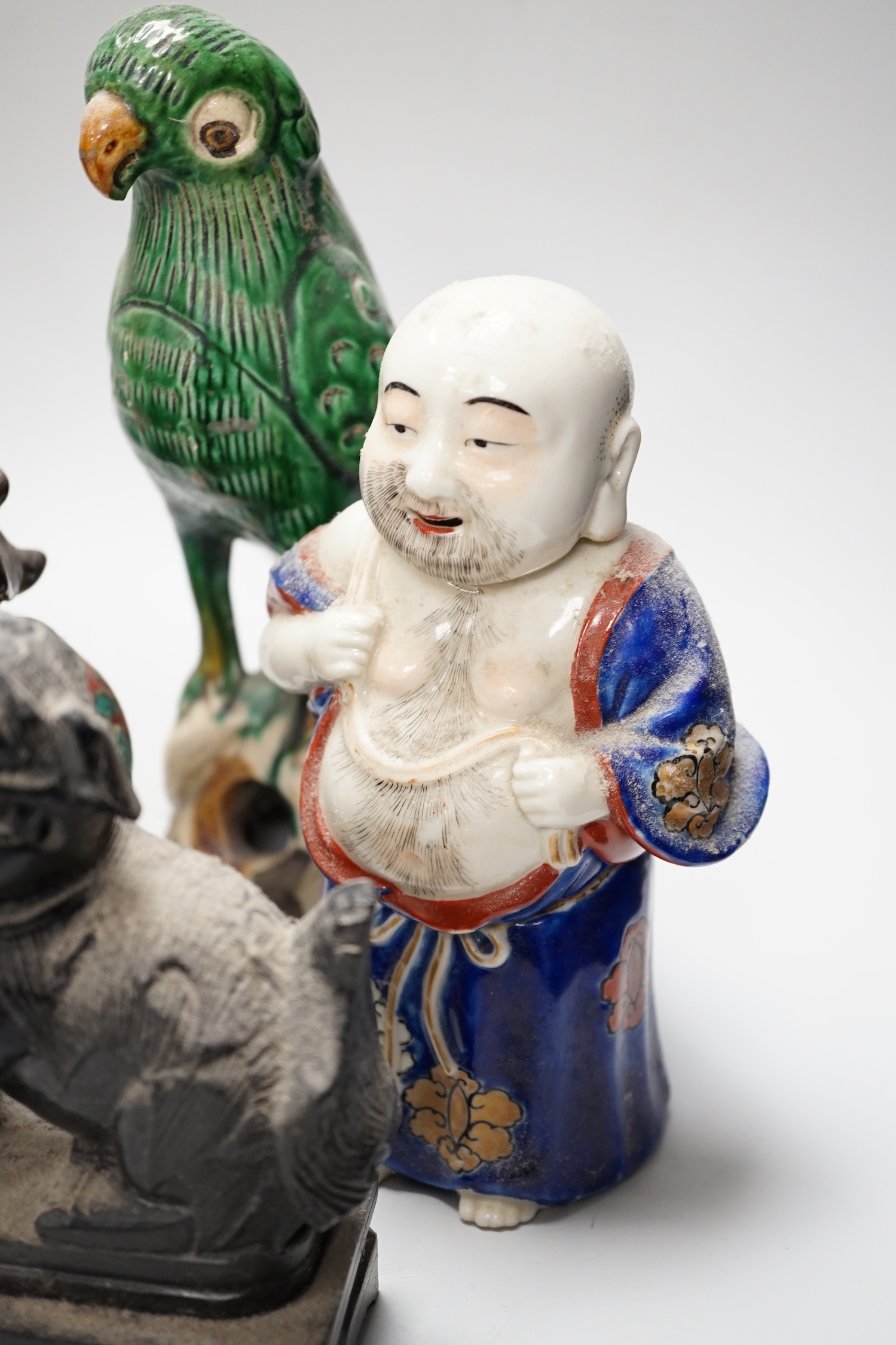 A group of assorted Chinese and Japanese pottery and porcelain figures, 19th/20th century, tallest 26cm high